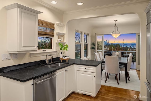 kitchen featuring white cabinetry, dishwasher, sink, dark hardwood / wood-style floors, and kitchen peninsula