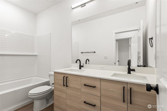 full bathroom with shower / bathing tub combination, vanity, and toilet