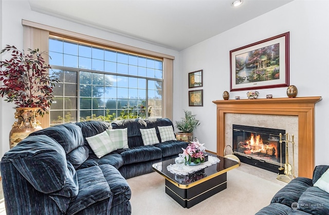 carpeted living room with a fireplace