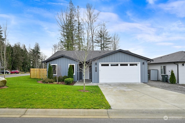 ranch-style house featuring a garage and a front lawn