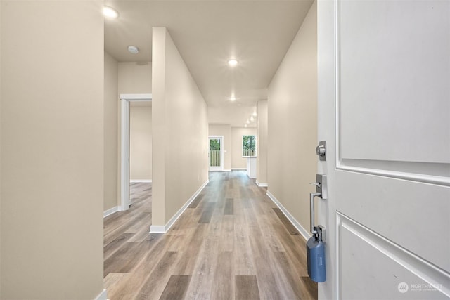 corridor with light wood-type flooring