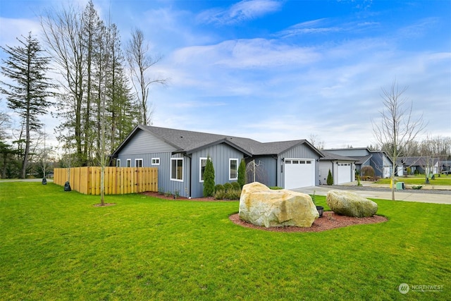 single story home with a garage and a front yard