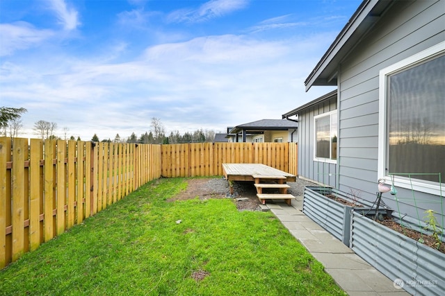 view of yard featuring a wooden deck