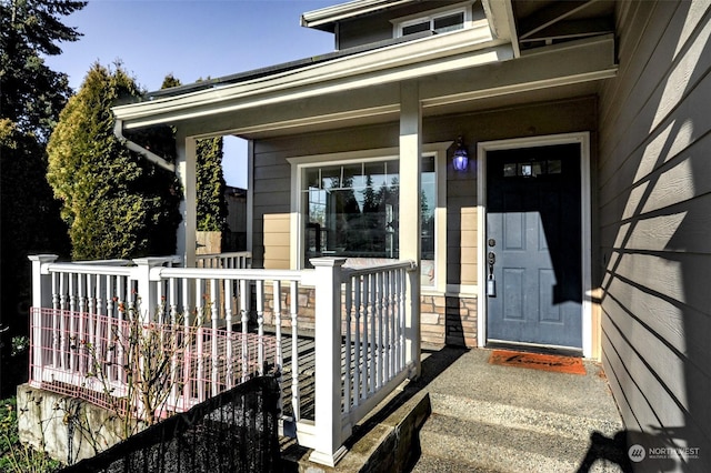 doorway to property with covered porch