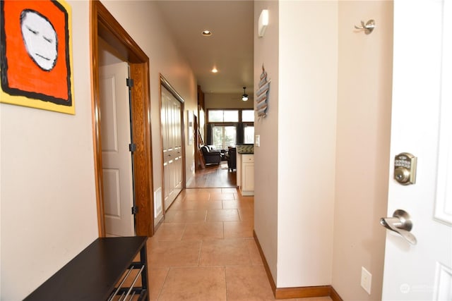 corridor with light tile patterned floors