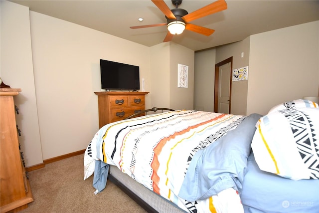 bedroom featuring ceiling fan and light carpet