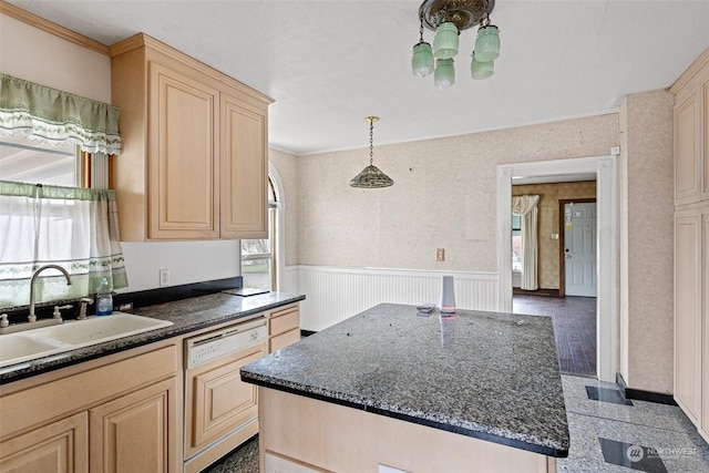 kitchen featuring crown molding, sink, light brown cabinets, and paneled dishwasher