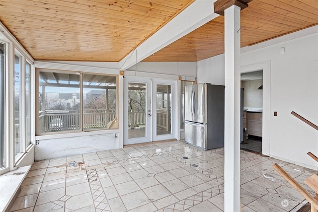 unfurnished sunroom with lofted ceiling, wooden ceiling, and french doors