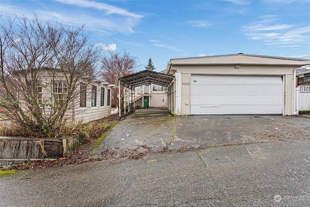 exterior space featuring a garage and a carport