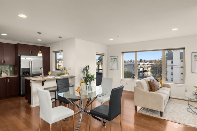 dining area with dark wood-type flooring