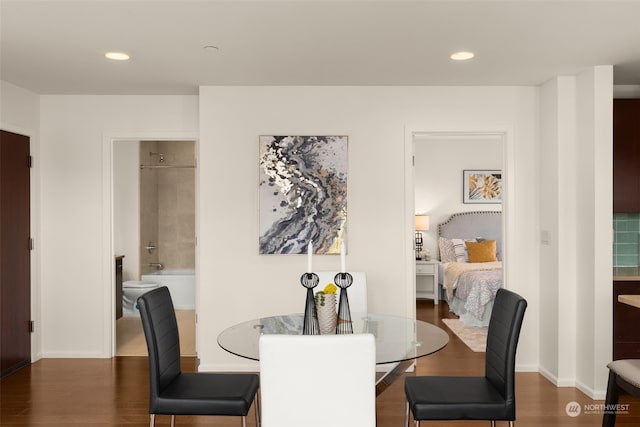 dining area with dark wood-type flooring