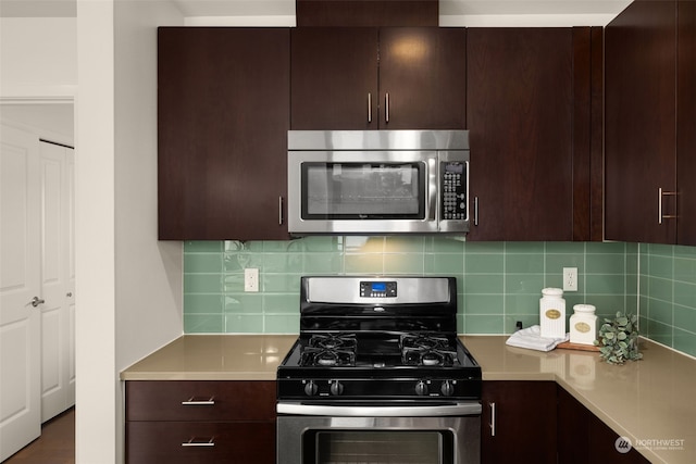 kitchen featuring dark brown cabinets, stainless steel appliances, and decorative backsplash