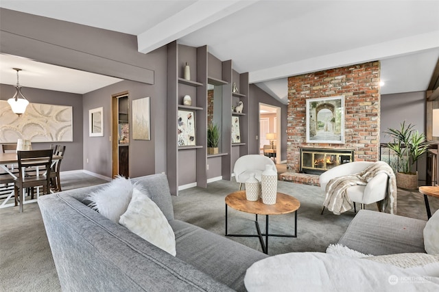 carpeted living room with beam ceiling, a fireplace, and built in shelves