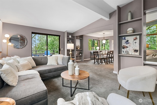 carpeted living room featuring vaulted ceiling with beams and built in features