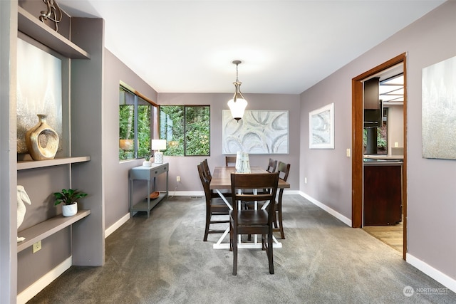 view of carpeted dining space