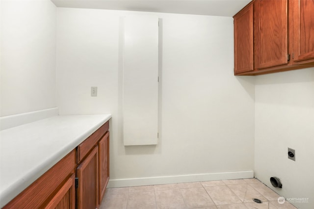 laundry room featuring cabinets and hookup for an electric dryer