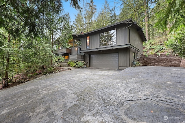 view of side of home featuring a garage