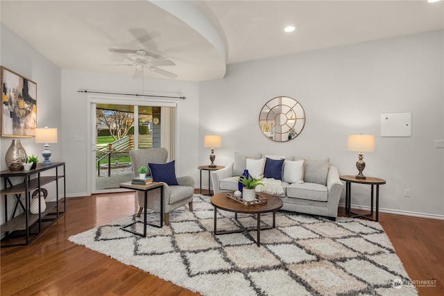 living room featuring hardwood / wood-style flooring and ceiling fan