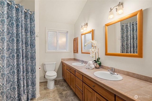 bathroom featuring lofted ceiling, vanity, toilet, and walk in shower