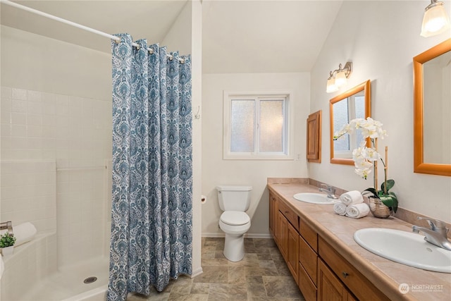 bathroom with vaulted ceiling, toilet, vanity, and a shower with shower curtain