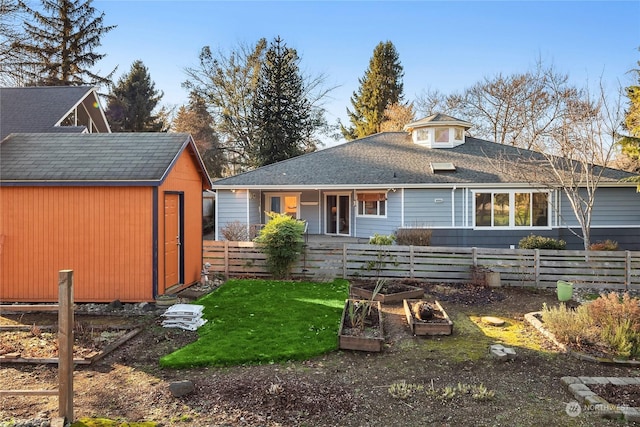 back of property with a storage shed and a porch