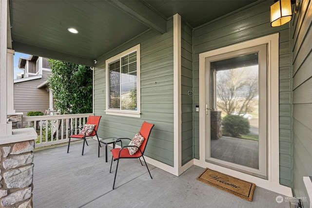 view of exterior entry with a porch