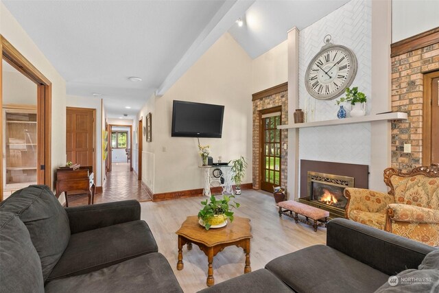 living room featuring light hardwood / wood-style flooring and lofted ceiling