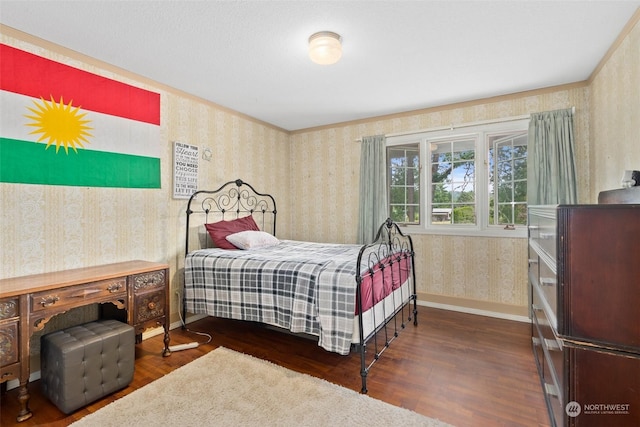 bedroom featuring dark hardwood / wood-style flooring