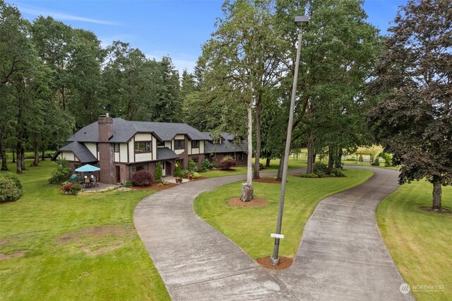 view of front of property with a front lawn