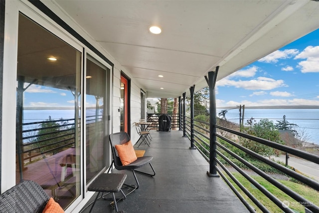 balcony featuring a water view