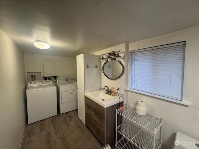 bathroom with washer and dryer, wood-type flooring, vanity, and toilet