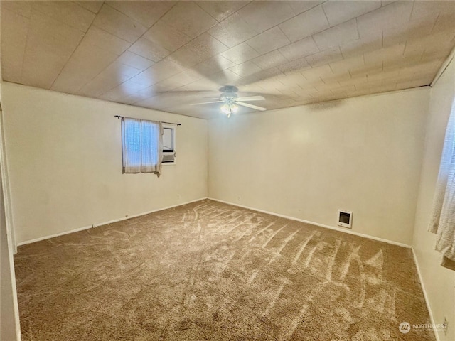 spare room with carpet and ceiling fan