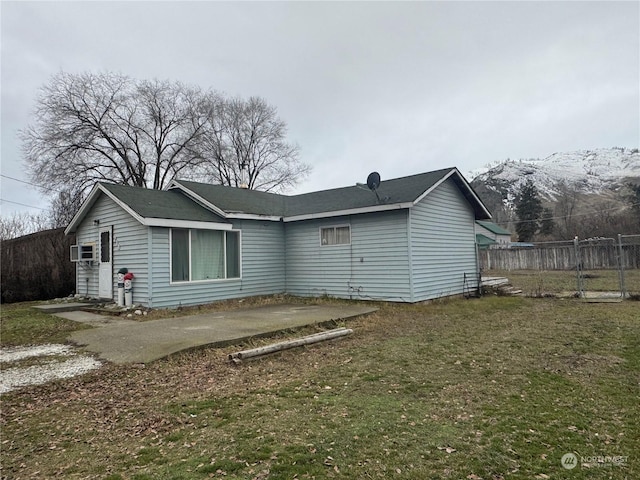 back of property featuring a lawn and a patio