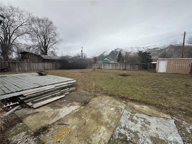 view of yard featuring a shed and a deck