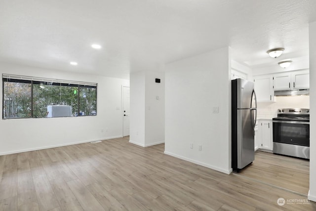 unfurnished living room with light hardwood / wood-style flooring