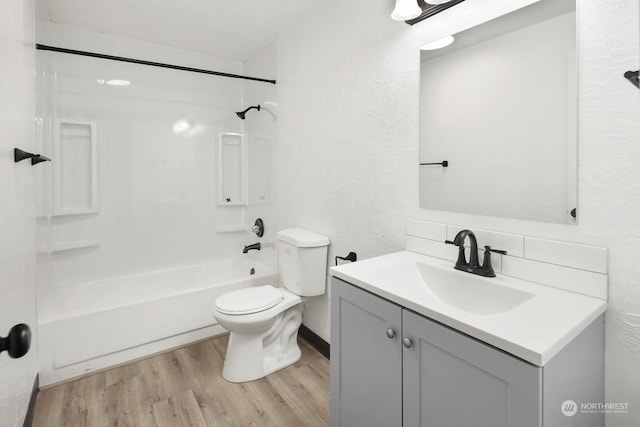 full bathroom featuring tub / shower combination, toilet, decorative backsplash, vanity, and hardwood / wood-style flooring