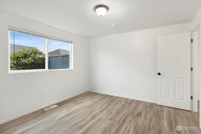 unfurnished room featuring light wood-type flooring