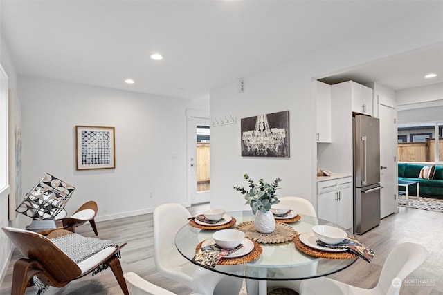 dining space featuring light hardwood / wood-style floors