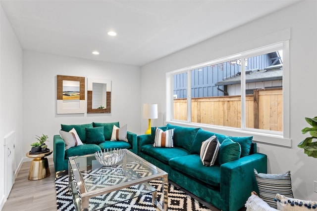 living room with light hardwood / wood-style flooring