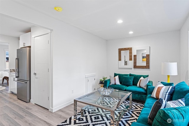 living room with light hardwood / wood-style flooring