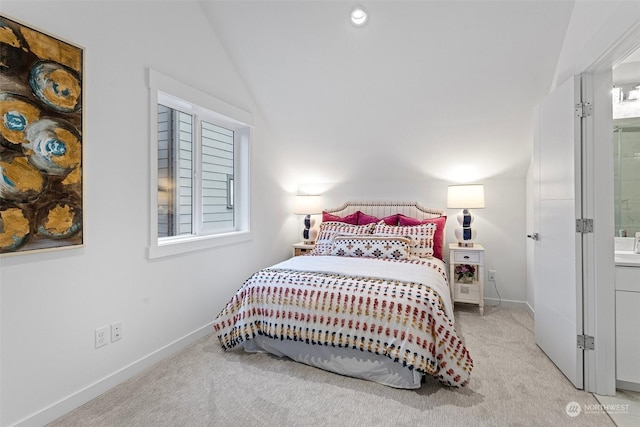 bedroom with vaulted ceiling and light colored carpet