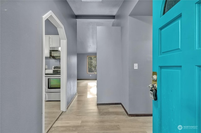 hall with light hardwood / wood-style flooring