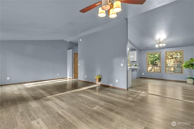 unfurnished living room featuring light hardwood / wood-style flooring, ceiling fan, and lofted ceiling