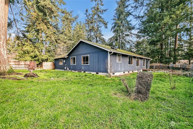 view of home's exterior with a lawn