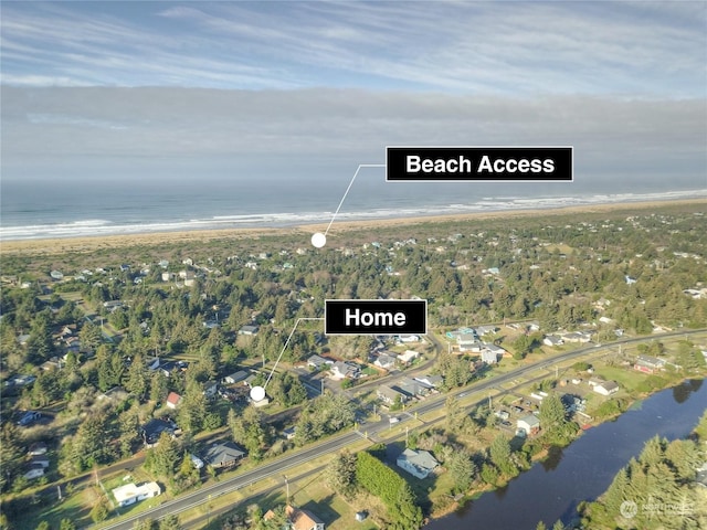 bird's eye view featuring a view of the beach and a water view