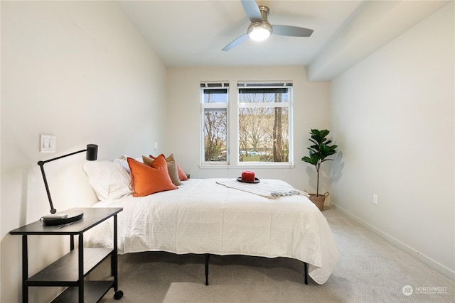 bedroom with ceiling fan and carpet floors