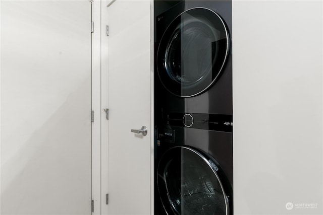 washroom with stacked washer and clothes dryer