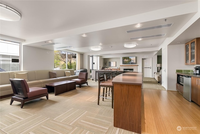 kitchen featuring a kitchen breakfast bar, a center island, and stainless steel appliances