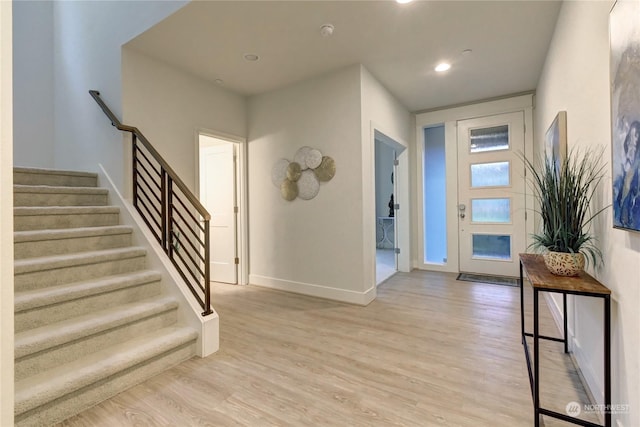 entryway with light hardwood / wood-style floors