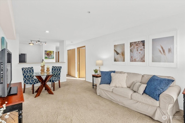 living room featuring light colored carpet